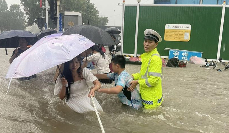 Tens of thousands evacuated as China storms spread northwards